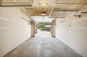 Attached garage w 2 additional parking spaces & storage