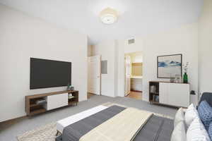 Primary ensuite bedroom with walk-in closet and nature preserve views