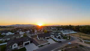 Aerial view at dusk featuring a mountain view