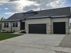 View of front of property featuring a garage