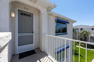 Entrance to property with a balcony