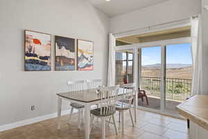 Dining area featuring plenty of natural light and light tile floors