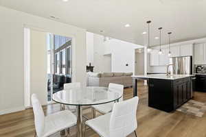 View of dining area looking into kitchen and living room area