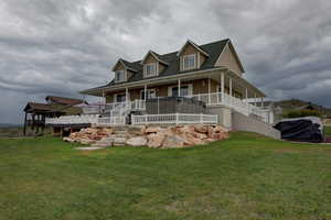 Exterior space featuring a yard and covered porch