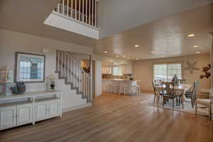 Dining space with sink and hardwood / wood-style flooring