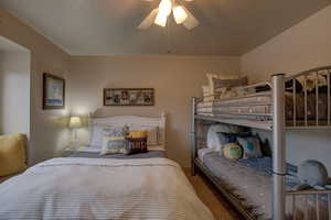 Bedroom featuring ceiling fan and carpet floors