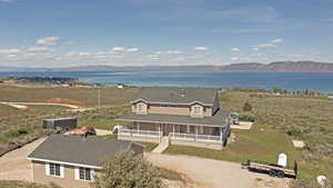 Aerial view featuring a water and mountain view