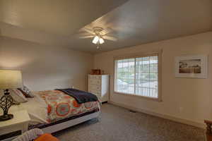 Bedroom featuring carpet and ceiling fan