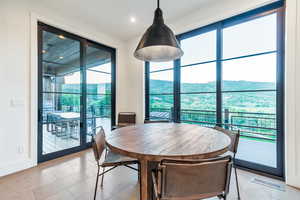 Dining space with tile flooring and a mountain view