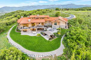 Birds eye view of property featuring a mountain view