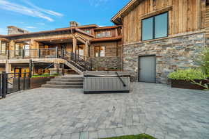 View of patio featuring a hot tub