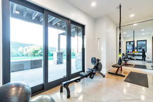 Workout room featuring concrete floors