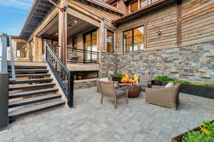 View of terrace featuring an outdoor living space with a fire pit