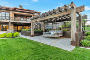 Exterior space featuring a pergola and a balcony