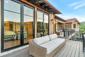 Wooden deck with an outdoor living space