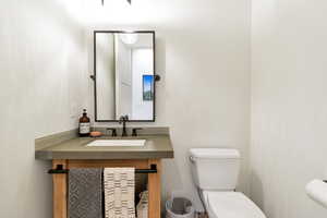 Bathroom with toilet and vanity