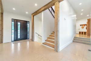 Foyer with light tile floors