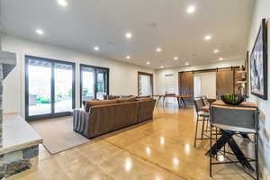 Living room featuring a barn door