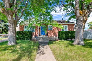 View of property featuring a front yard