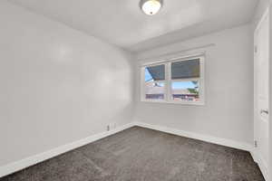 View of carpeted spare room