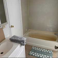 Bathroom with tile floors and vanity