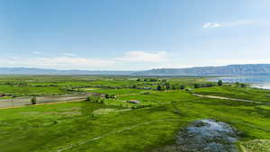 Exterior space with a water and mountain view and a rural view