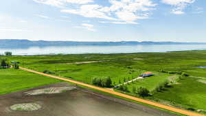 Birds eye view of property with a rural view and a water and mountain view