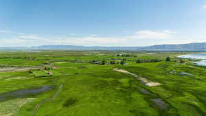 Birds eye view of property with a rural view and a water and mountain view