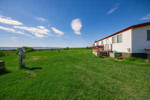 View of yard featuring a wooden deck