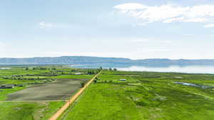 Birds eye view of property featuring a water and mountain view