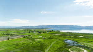 View of mountain feature featuring a water view and a rural view