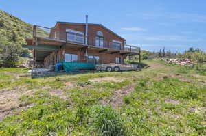 Rear view of house featuring a balcony