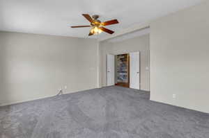 Spare room with carpet and ceiling fan