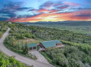 Aerial view at dusk featuring a mountain view