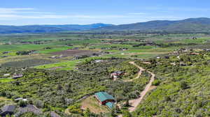 Birds eye view of property with a mountain view