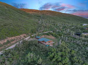 Aerial view at dusk featuring a mountain view