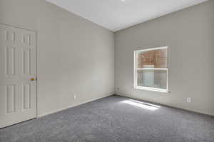 Empty room featuring carpet floors