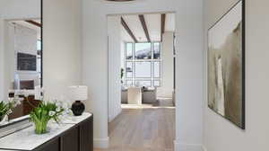 Hall featuring beam ceiling and light hardwood / wood-style flooring