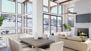 Dining area with wood-type flooring, a high ceiling, and ceiling fan