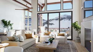 Living room featuring ceiling fan, hardwood / wood-style flooring, high vaulted ceiling, beamed ceiling, and a mountain view