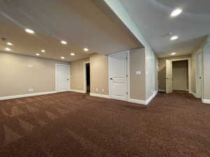 Family room with dark carpet