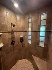 Primary bathroom with a tile shower