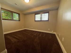 Bedroom with carpet and lots of natural sunlight