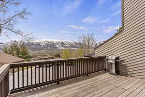 Wooden terrace featuring a mountain view