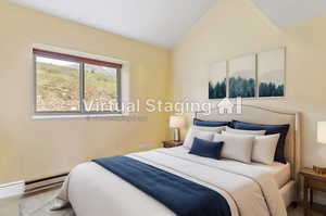 Bedroom featuring high vaulted ceiling and a baseboard heating unit