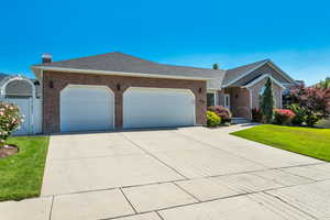 Three car garage with heated driveway.