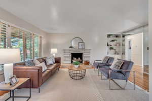 Living room featuring a fireplace and hardwood / wood-style flooring