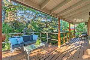 Wooden terrace featuring an outdoor living space