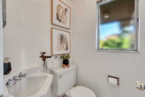 Bathroom featuring sink and toilet