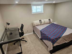 Bedroom featuring carpet floors